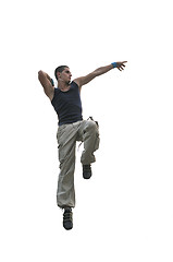 Image showing young man jumping in air outdoor at night ready for party