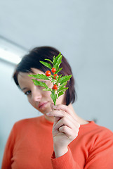 Image showing Beautiful  girl holding young plant