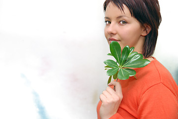 Image showing Beautiful  girl holding young plant