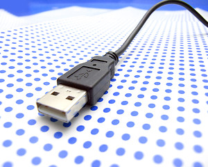 Image showing usb cable on dotted background