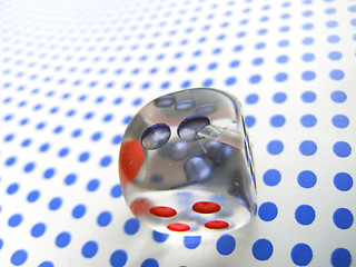 Image showing gamblig dice on blue dotted background