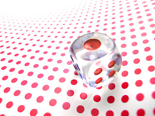 Image showing gambling dice on red dotted background