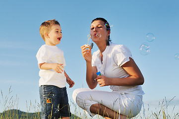 Image showing woman child bubble