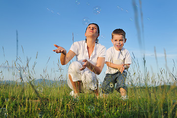 Image showing woman child bubble