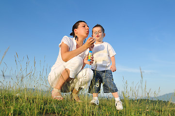 Image showing woman child bubble