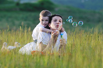 Image showing woman child bubble