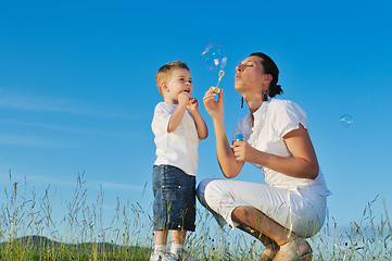 Image showing woman child bubble