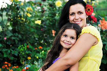 Image showing happy mom and daughter outdoor