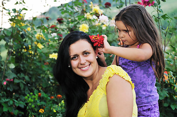 Image showing happy mom and daughter outdoor