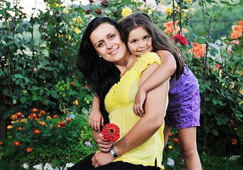 Image showing happy mom and daughter outdoor