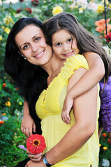 Image showing happy mom and daughter outdoor