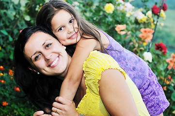 Image showing happy mom and daughter outdoor