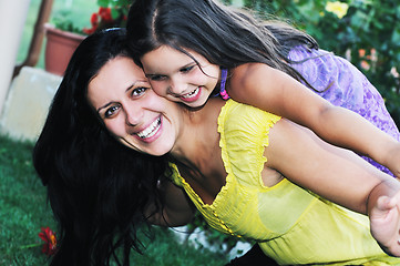 Image showing happy mom and daughter outdoor
