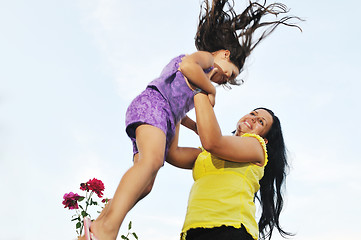 Image showing happy mom and daughter outdoor