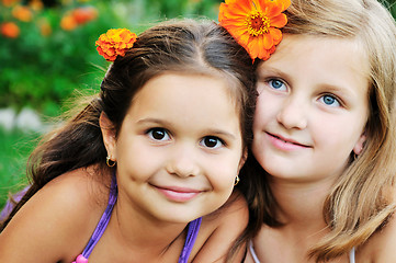 Image showing two happy girls have fun outdoor 