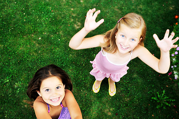 Image showing two happy girls have fun outdoor 