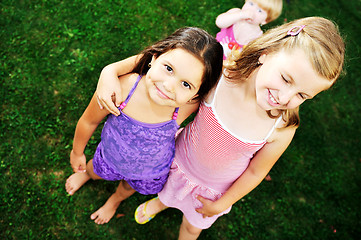 Image showing two happy girls have fun outdoor 