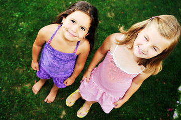 Image showing two happy girls have fun outdoor 