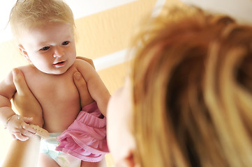 Image showing beautiful blonde young mother and cute baby