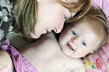 Image showing beautiful blonde young mother and cute baby