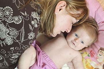 Image showing beautiful blonde young mother and cute baby