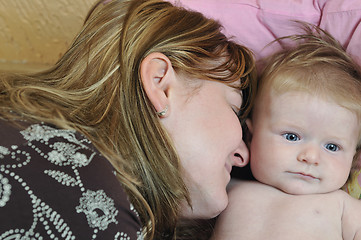 Image showing beautiful blonde young mother and cute baby