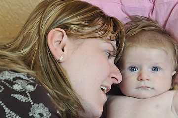 Image showing beautiful blonde young mother and cute baby