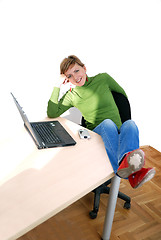 Image showing casual girl relaxing at the office