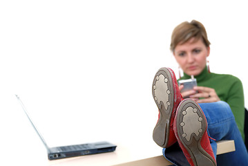 Image showing casual girl relaxing at the office