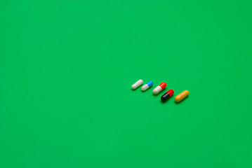 Image showing pills on green background