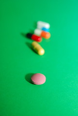 Image showing pills on green background