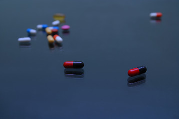 Image showing pills on glosy surface