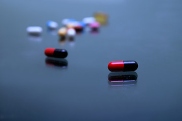 Image showing pills on glosy surface