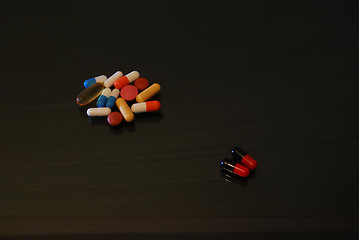 Image showing pills on glosy surface