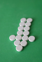 Image showing tablets in arrow formation