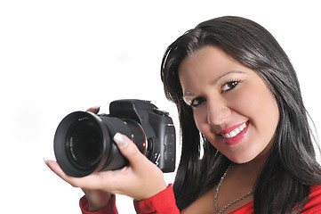 Image showing Young woman holding camera in hand taking picture isolated