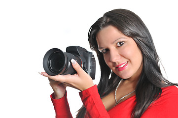 Image showing Young woman holding camera in hand taking picture isolated