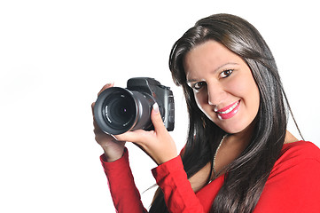 Image showing Young woman holding camera in hand taking picture isolated