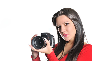 Image showing Young woman holding camera in hand taking picture isolated