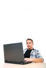 Image showing young man working on laptop