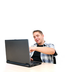 Image showing young man working on laptop