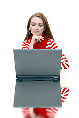 Image showing businesswoman  in red with reflection...