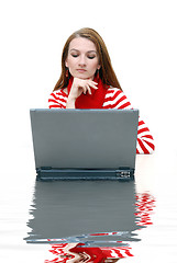 Image showing businesswoman  in red with reflection...