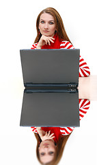 Image showing businesswoman  in red with reflection...