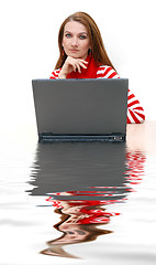 Image showing businesswoman  in red with reflection...