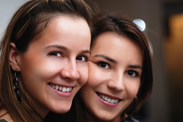 Image showing Two gorgeus women smiling