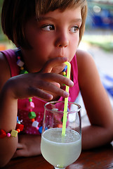 Image showing Cute little gilr enjoying cold drink