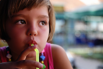 Image showing Cute little gilr enjoying cold drink