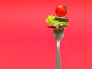 Image showing sliced vegetables on fork