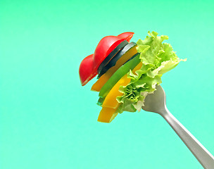 Image showing sliced vegetables on fork...